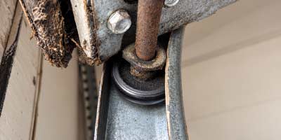 Garage door roller and track assembly