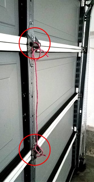 Tie A rope in Between the Garage Door Hinges