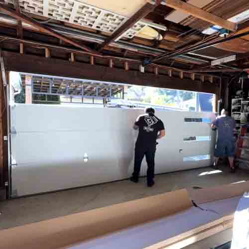 Champion Garage Door technicians installing a modern garage door