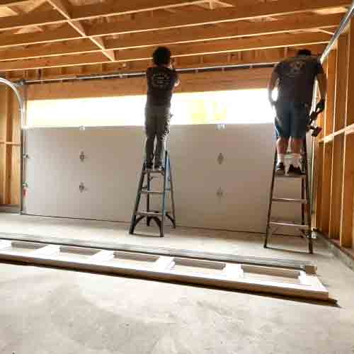 Installing a new garage door in a new construction home
