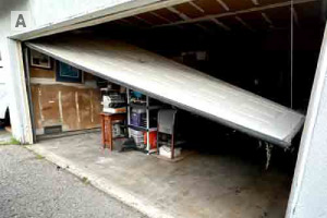 Off track door due to broken rollers