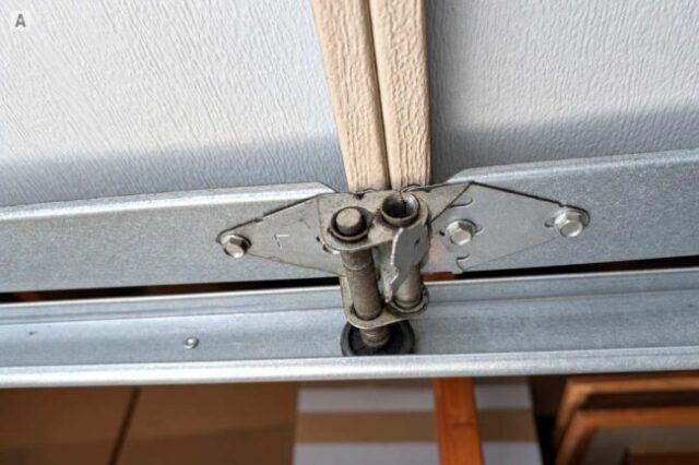 Broken Garage Door Hinge Found During Tune-Up Broken garage door hinge found during a maintenance visit