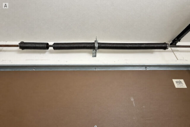 Broken Torsion Spring Before Replacement Broken torsion spring before replacement