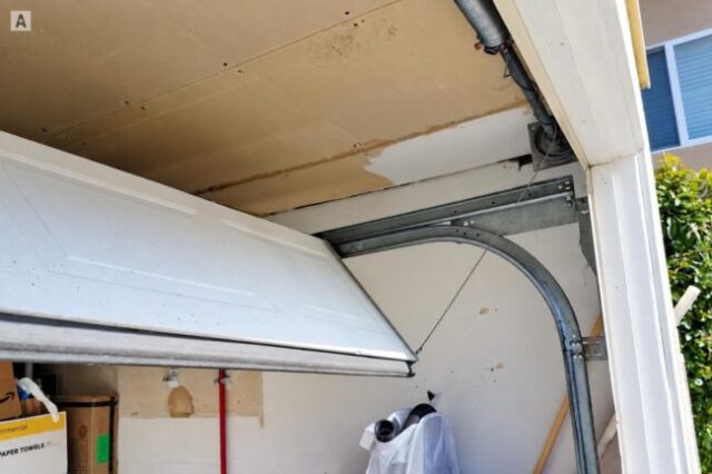 Garage Door Hanging Out of Track Off-track garage door hanging unevenly