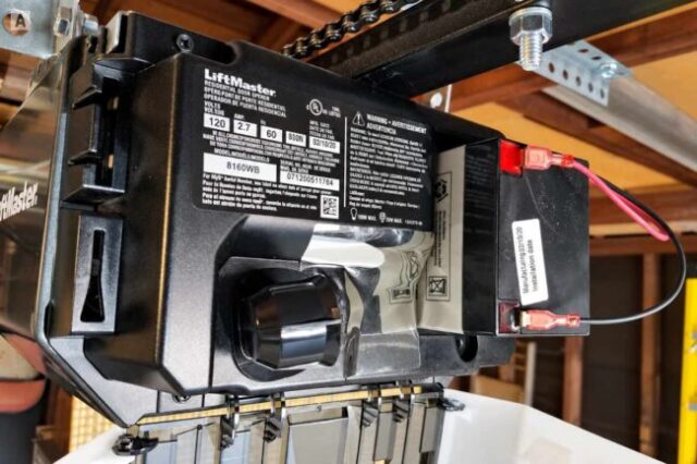 Garage Door Opener Battery Backup Repair LiftMaster garage door opener with the battery backup compartment open