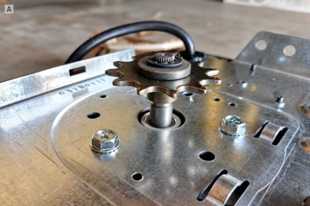 Garage Door Opener Sprocket Repair Close-up of a garage door opener sprocket and drive shaft