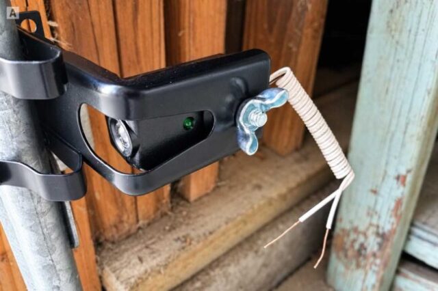 Garage Door Safety Sensor Repair Garage door safety sensor mounted to the track with disconnected wiring