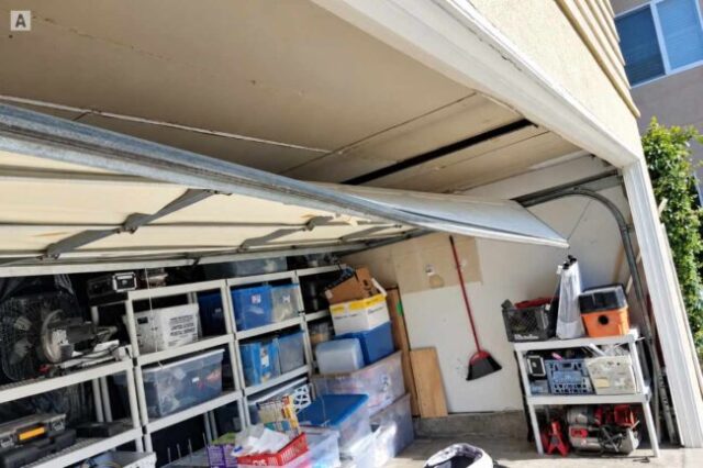 Garage Door Shifted Out of Position Garage door shifted out of the tracks and hanging unevenly