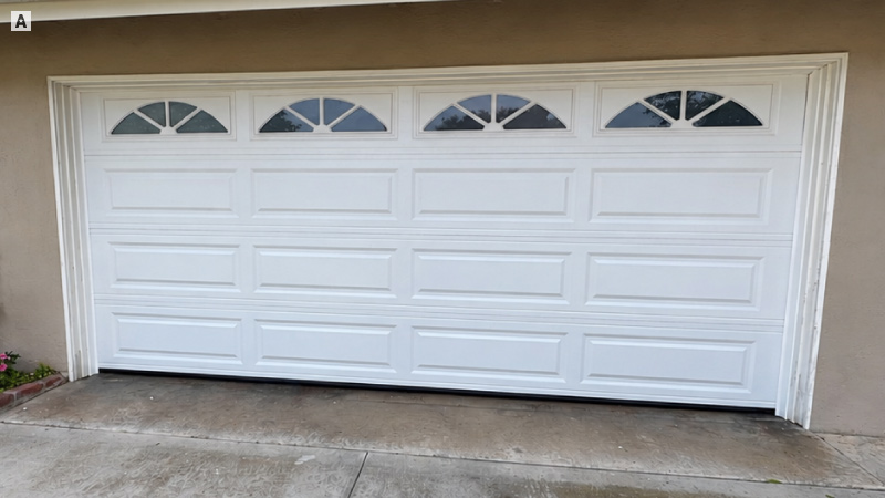 Completed garage door installation with raised panels and arched windows in Huntington Beach
