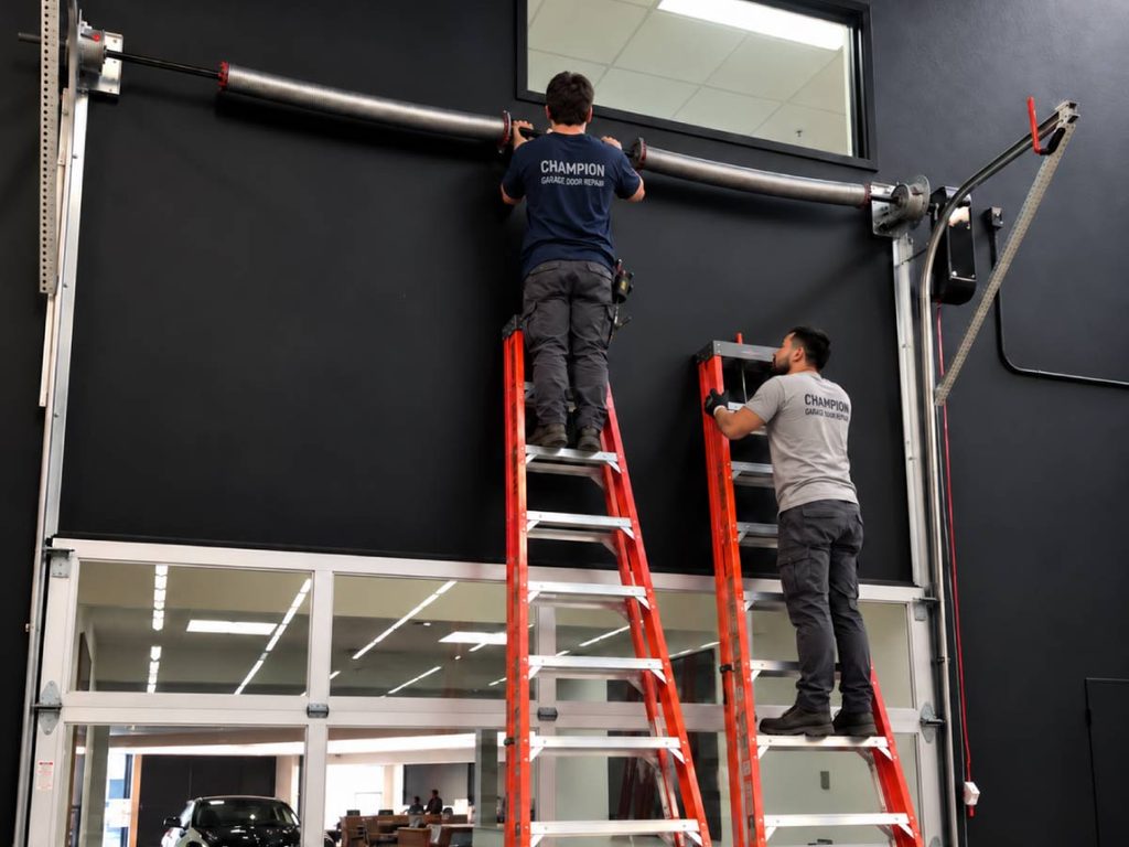 Champion garage door technicians working on a garage door